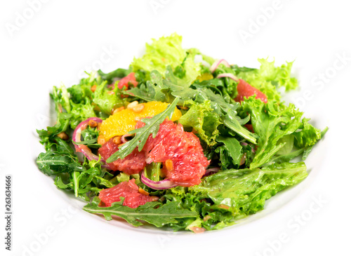 Fresh salad with grapefruit, and pomegranate seeds.