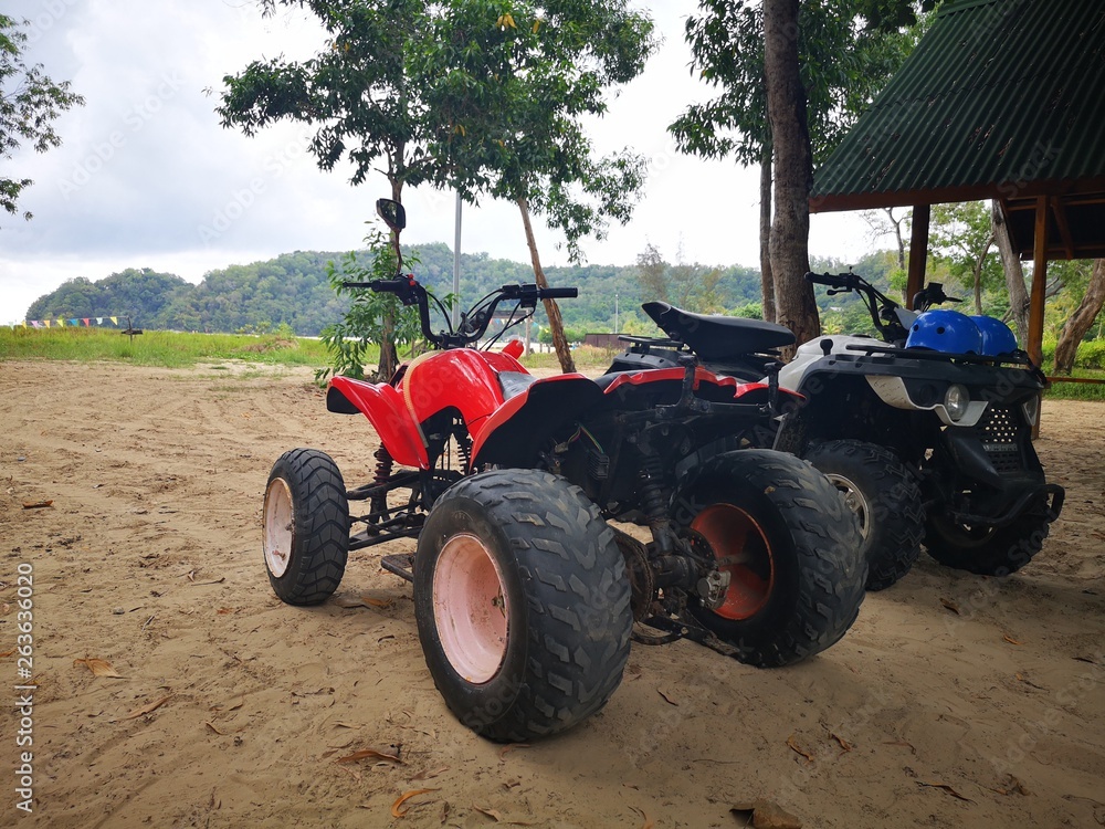 Bike sport and ATV sport recreation activities on sandy beach Bike sport and ATV sport recreation activities on sandy beach