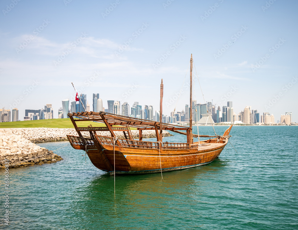 Dhow Boat At The MIA Lake with Doha City Center on the Background
