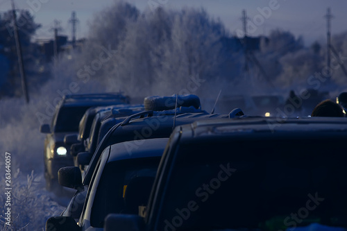 cars on winter road traffic jam city / winter weather on the city highway, the view from car in the fog and snow road © kichigin19