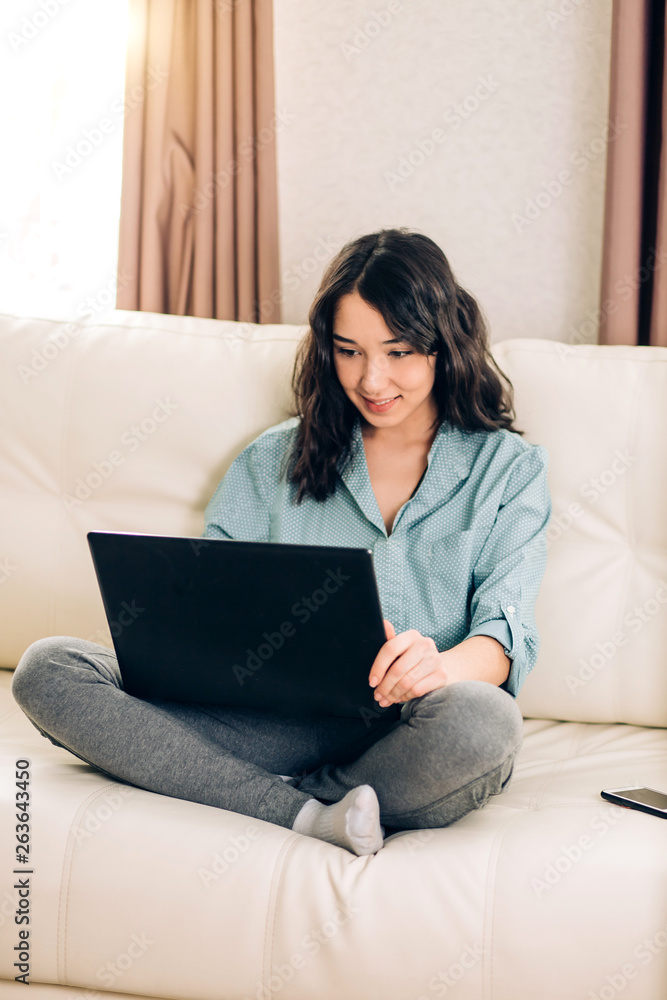 Bbeautiful woman using laptop computer at home on sofa Bbeautiful woman using laptop computer at home on sofa