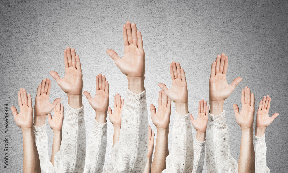 Row of man hands showing voting gesture