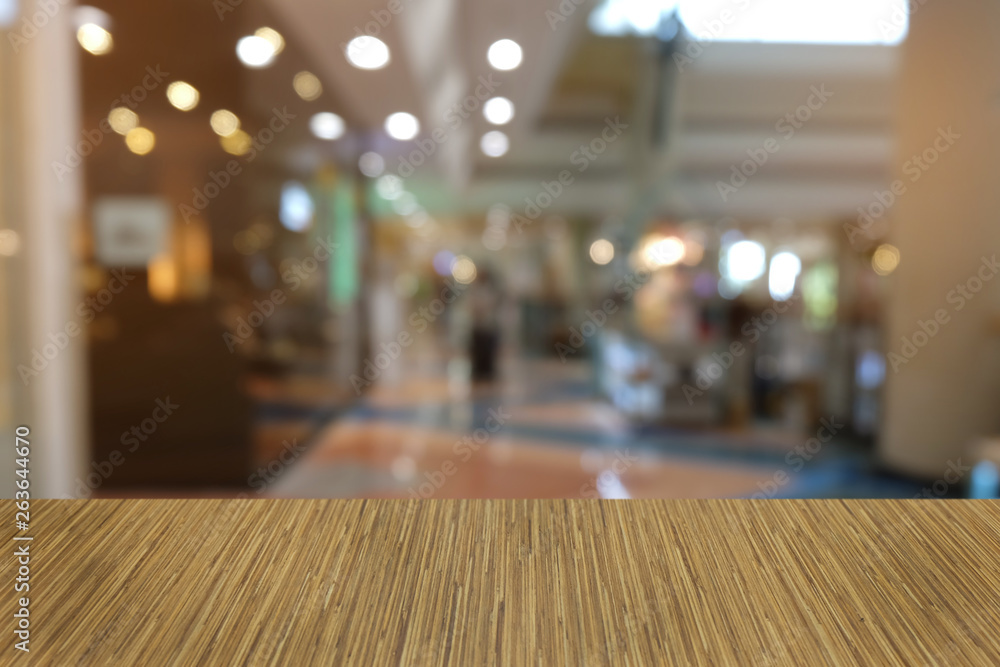 Empty dark wooden table in front of abstract blurred bokeh background of restaurant . can be used for display or montage your products.Mock up for space. Empty dark wooden table in front of abstract blurred bokeh background of restaurant . can be used for display or montage your products.Mock up for space.