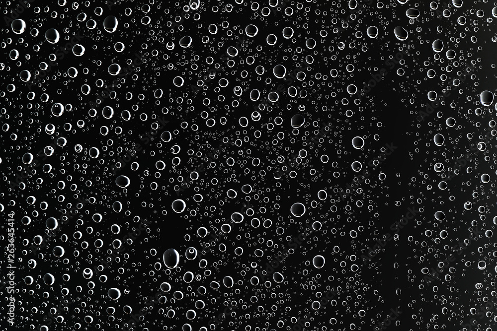 black wet background / raindrops for overlaying on window, concept of autumn weather, background of drops of water rain on glass transparent black wet background / raindrops for overlaying on window, concept of autumn weather, background of drops of water rain on glass transparent