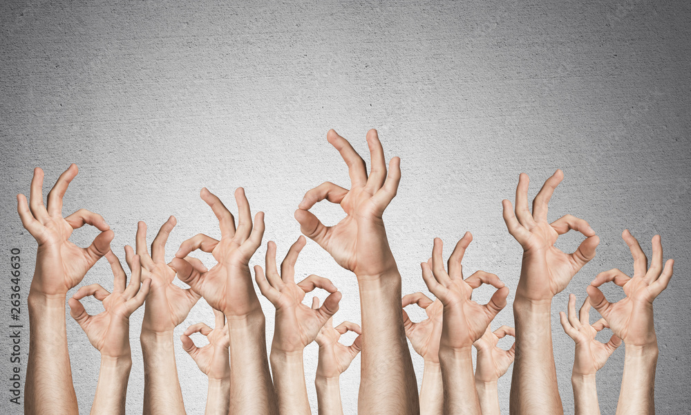 Row of man hands showing okay gesture