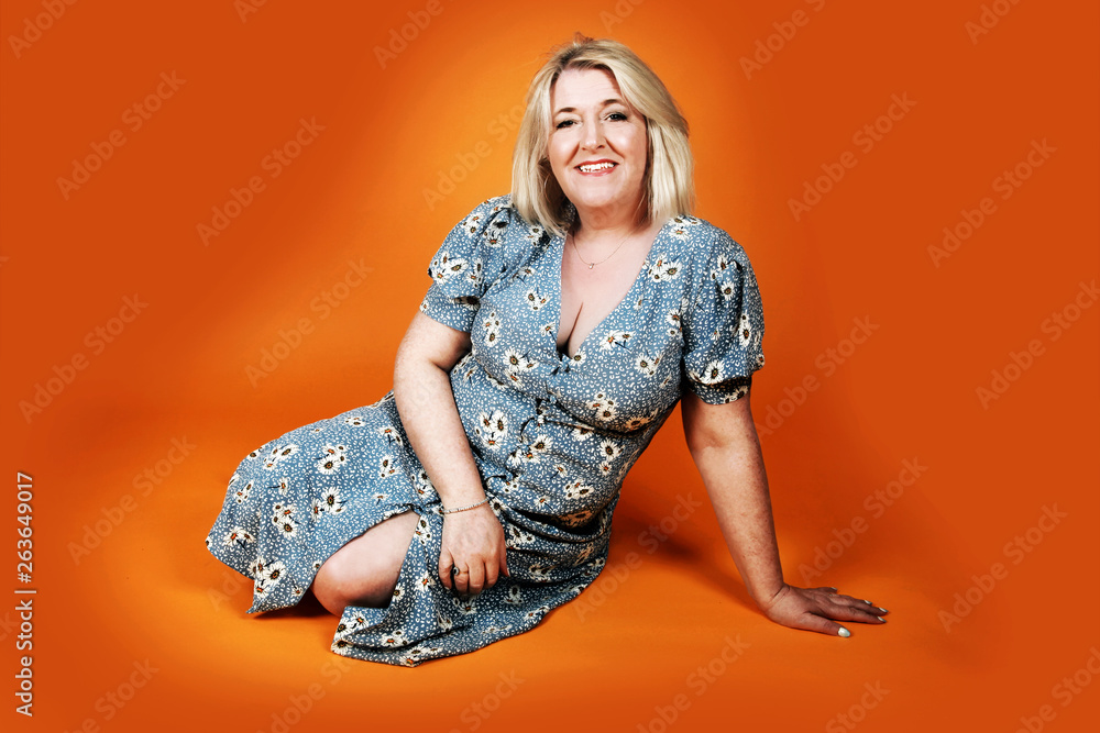 sexy milf in flowery shift dress relaxing Stock Photo | Adobe Stock