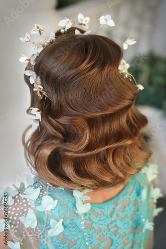 Elegant vintage hairstyle wave back view.