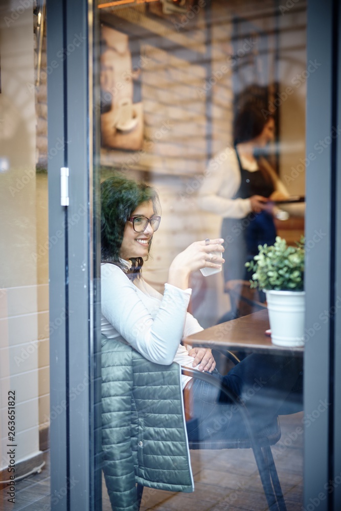 Happy young woman in cafe Happy young woman in cafe