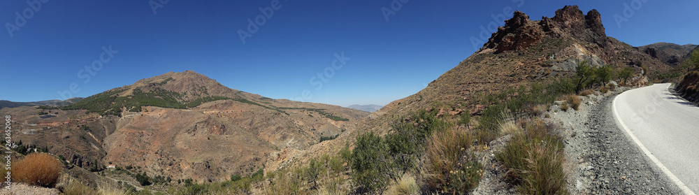 Panoramic view rocky moutain with road and nature.