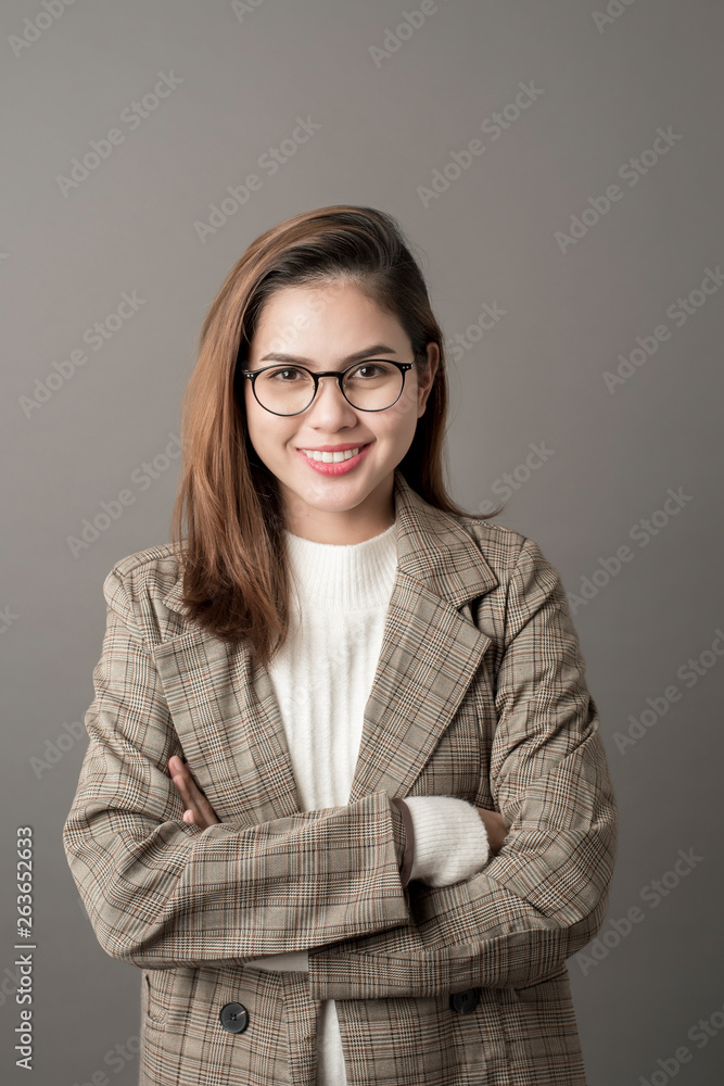 Portrait of Attractive business woman in studio grey background Portrait of Attractive business woman in studio grey background