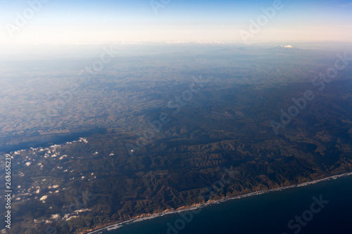 Fototapeta Naklejka Na Ścianę i Meble -  Flying above the clouds, view from the airplane, North Island, New Zealand