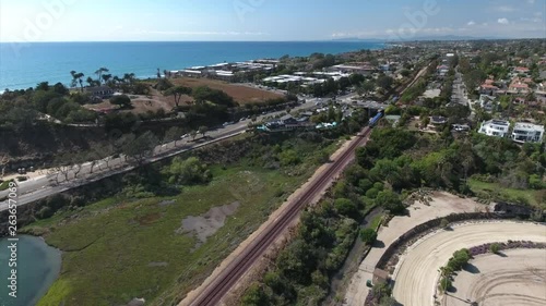 Aerial drone footage of train passing Del Mar racetrack in the San Diego. photo