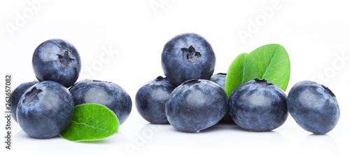 Fresh raw organic blueberries in vintage wooden box on stone kitchen background.
