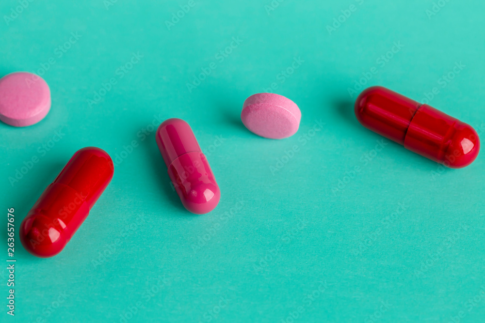 Red and pink medicinal tablets and capsules Red and pink medicinal tablets and capsules