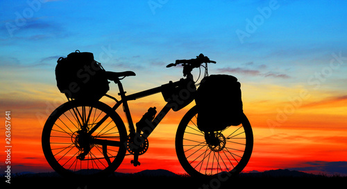 silhouette vintage bike on sunrise