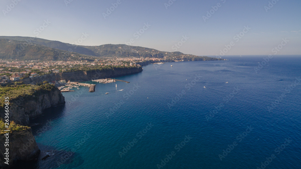 View of the Sorrento coast. Meta beach, travel concept, space for text, bay with boats, Italia mountains, travel concept