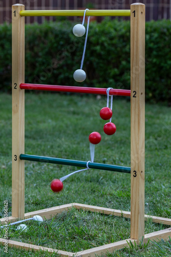 Game of ladder golf set up outdoors in a garden