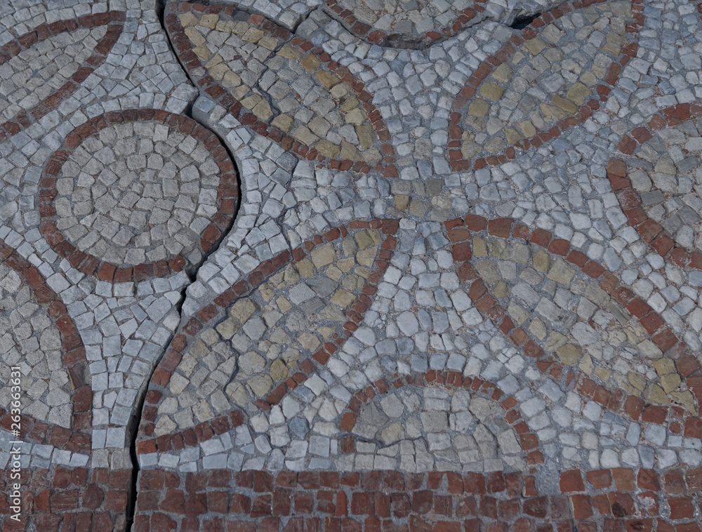 Elements of an ancient ceramic mosaic on the stone