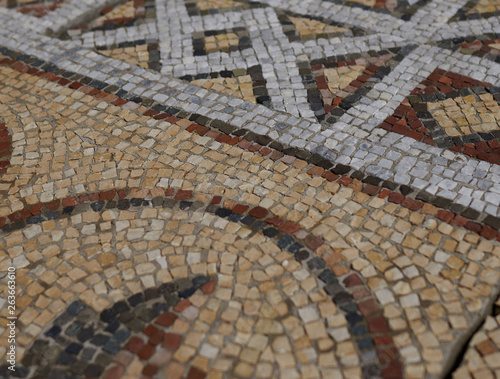 Elements of an ancient ceramic mosaic on the stone