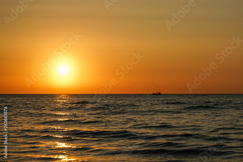Fisherman heading home in the setting sun. © frederik