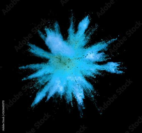 Explosion of blue powder on black background