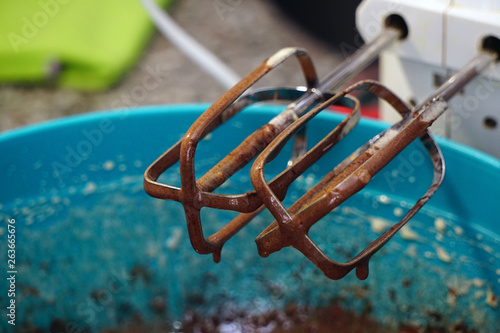 Preparing brownie cake at home with mixer whisk and oven processes