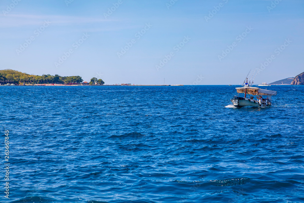 touristic fishing boat on blue sea
