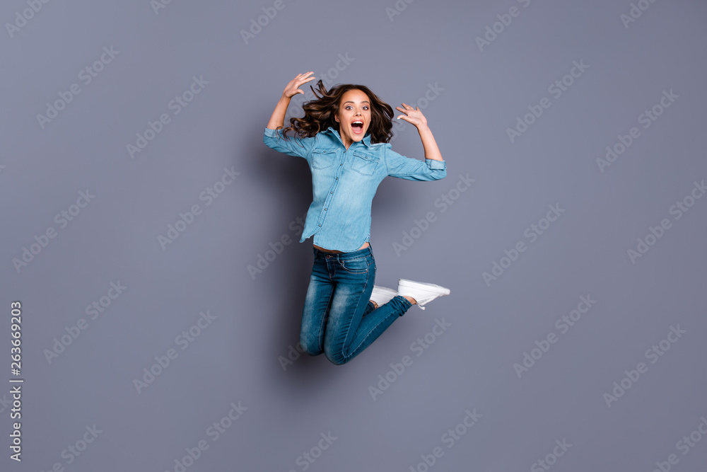 Full length body size photo amazing beautiful her she lady jump high sale discount shopping low prices black friday shop store mall wearing casual jeans denim shirt clothes isolated grey background Full length body size photo amazing beautiful her she lady jump high sale discount shopping low prices black friday shop store mall wearing casual jeans denim shirt clothes isolated grey background