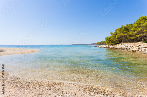 Fototapeta Naklejka Na Ścianę i Meble -  Pine beach, Pakostane, Croatia - Calm scenery at the natural beach of Pakostane