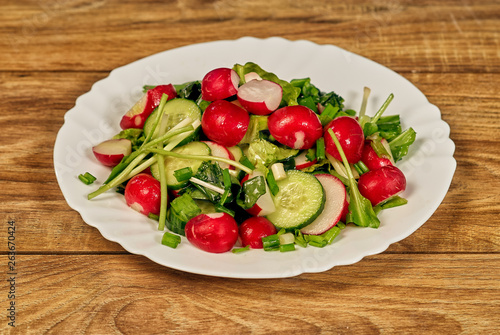 Spring salad with radish , onion and cucumber