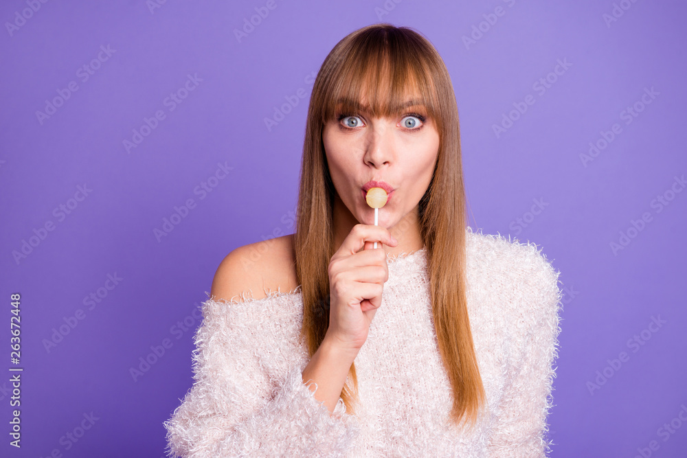 Close-up portrait of her she nice-looking attractive sweet fascinating winsome lovely cheerful positive straight-haired lady licking lolli isolated on bright vivid shine violet purple background Close-up portrait of her she nice-looking attractive sweet fascinating winsome lovely cheerful positive straight-haired lady licking lolli isolated on bright vivid shine violet purple background