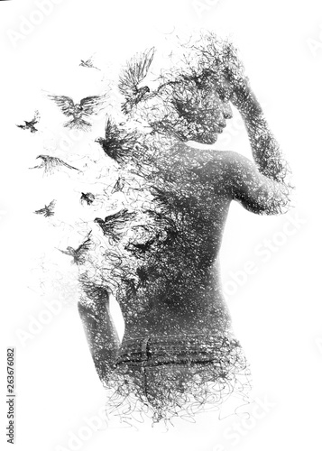 Paintography. Double exposure of a shirtless male model combined with handmade pen drawing of birds flying away and disintegrating, black and white