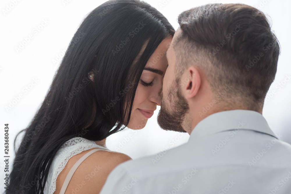 bearded man and attractive brunette young woman with closed eyes bearded man and attractive brunette young woman with closed eyes