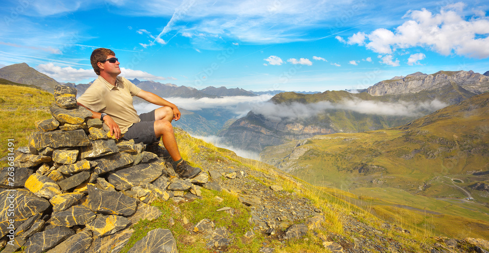 Pyrenees; mountain; tourist; resting; sitting; man; relax; relaxing; watching; deep; valley; hiking; outdoor; landscape; Occidentales; rocks; rocky; fog; France; highland; level; stones; stony; upland Pyrenees; mountain; tourist; resting; sitting; man; relax; relaxing; watching; deep; valley; hiking; outdoor; landscape; Occidentales; rocks; rocky; fog; France; highland; level; stones; stony; upland