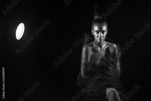 Nude portrait of beautiful woman on stage