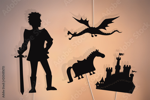 Dragon, knight, castle and horse shadow puppets. photo