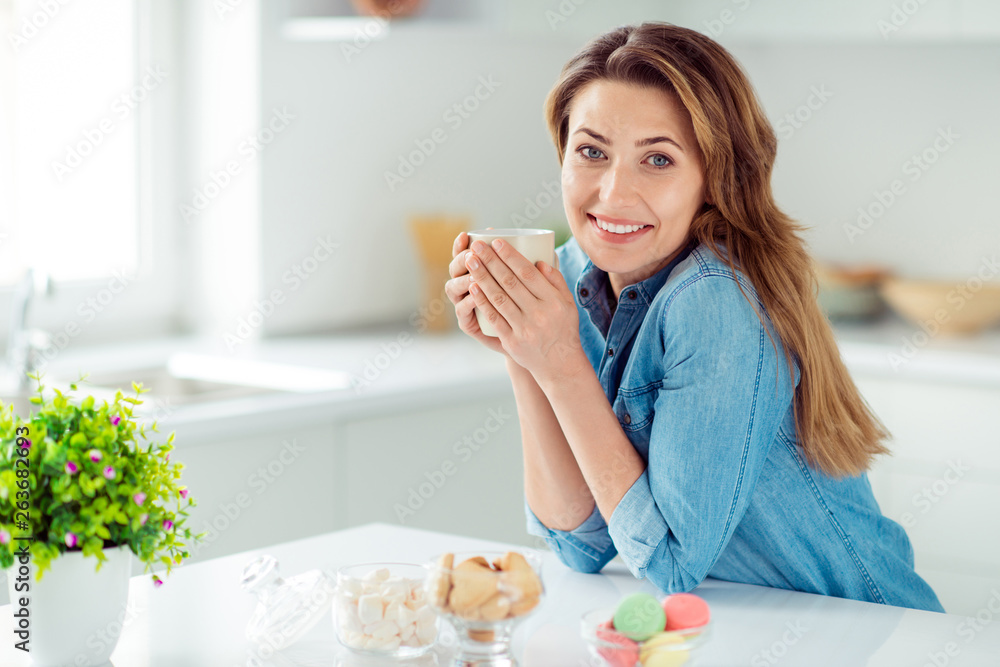 Portrait of her she nice-looking lovely sweet adorable charming attractive cheerful cheery dreamy brown-haired lady enjoying delicious lunch espresso in light white interior style kitchen
