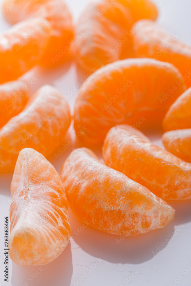 juicy mandarin on a white acrylic background juicy mandarin on a white acrylic background