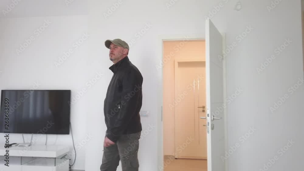 man entering his new home. man walking in new house after relocation. Man viewing a potential new home. man entering his new home. man walking in new house after relocation. Man viewing a potential new home.