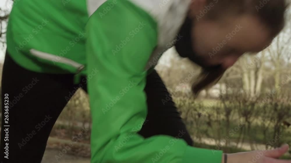 SLOW MOTION: female sprinter starts exercising. SLOW MOTION: female sprinter starts exercising.