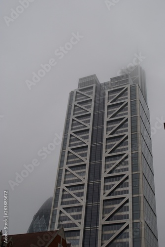 Skyscraper and foggy sky