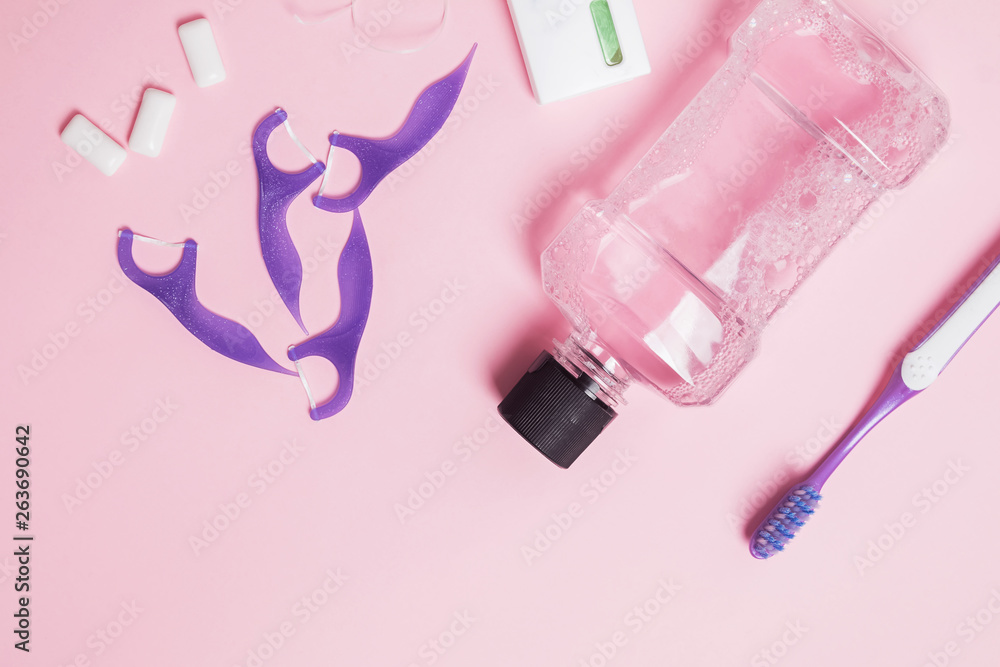 Dental care accessories on the pink background Dental care accessories on the pink background
