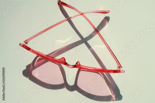 Stylish feminine cat eye sunglasses on the white table