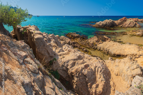 Spain beach. Blue summer sea rocky beach in spanish coast