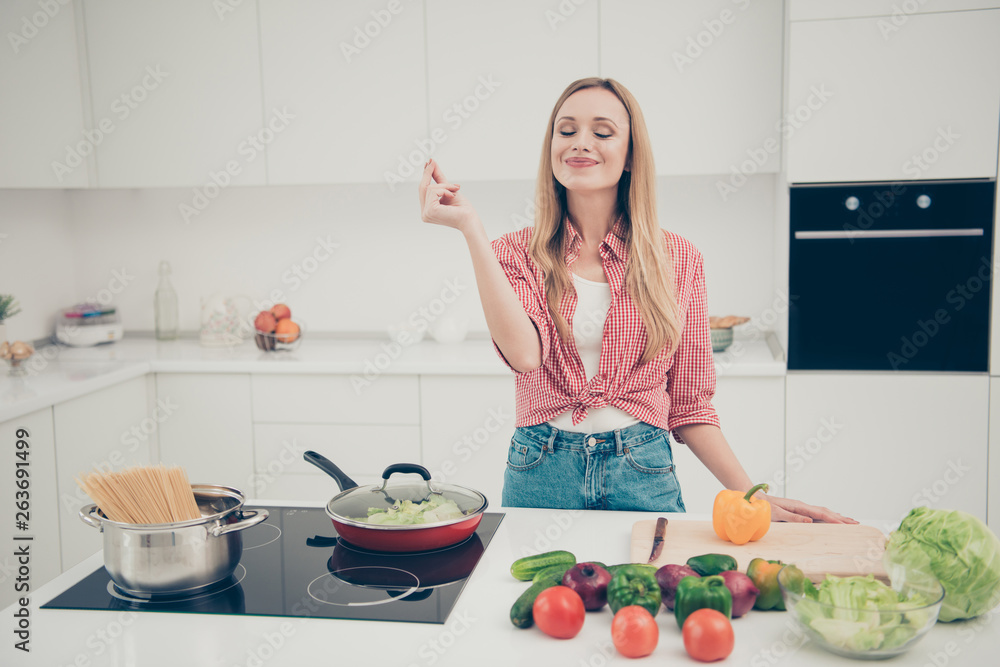 Close up photo beautiful she her lady fingers belissimo okey symbol check quality advising meal dish expert yummy wear domestic home apparel shirt jeans denim outfit bright home kitchen indoors