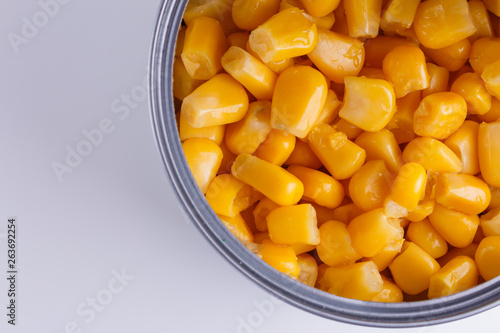 Canned corn in a iron can on white background