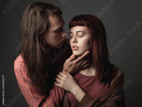 Passionate couple on the gray background