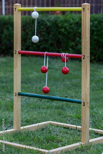 Game of ladder golf set up outdoors in a garden