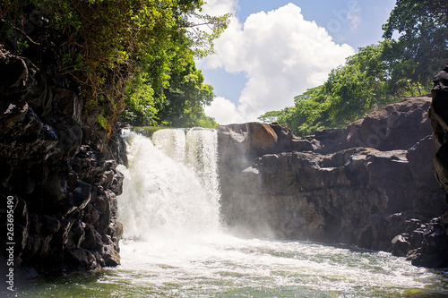 Waterfall  near the island of Mauritius from a boat trip. Beautiful landscape view
