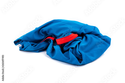 Stack or pile of blue t shirt isolated on white background.